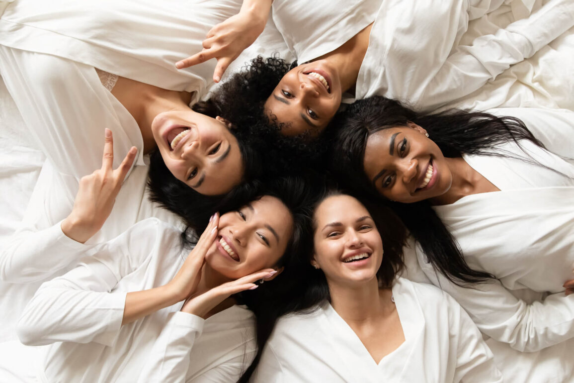 group of smiling women who use hyaluronic acid for skin
